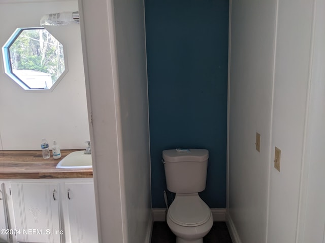 bathroom with vanity and toilet