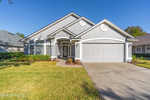 view of front facade featuring a front lawn and a garage