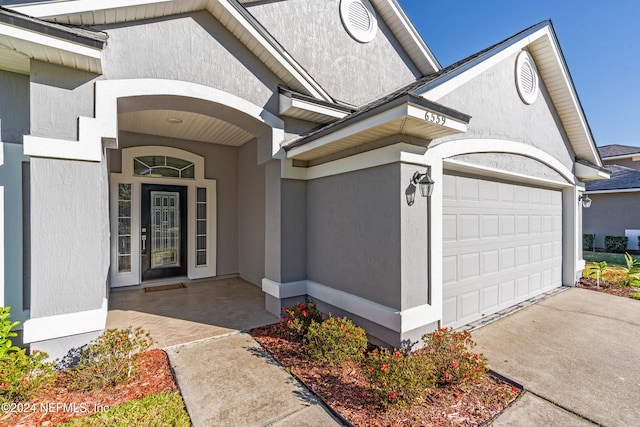 property entrance with a garage