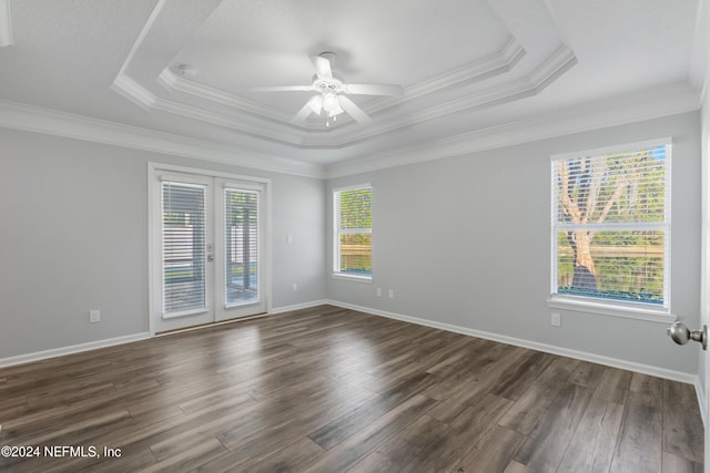 empty room with french doors, dark hardwood / wood-style flooring, plenty of natural light, and ceiling fan