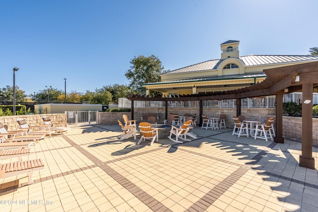 view of patio / terrace with a fire pit