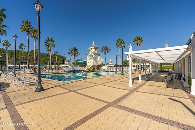 view of swimming pool featuring a patio area and a pergola