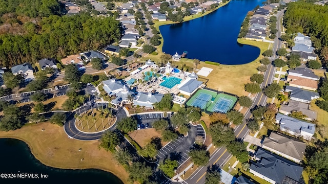 birds eye view of property with a water view