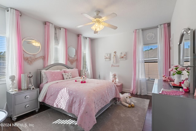 bedroom with ceiling fan and dark hardwood / wood-style flooring