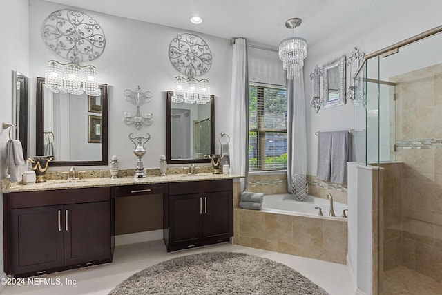 bathroom featuring tile patterned floors, vanity, independent shower and bath, and an inviting chandelier