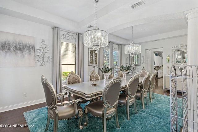 dining room featuring a chandelier and dark hardwood / wood-style floors