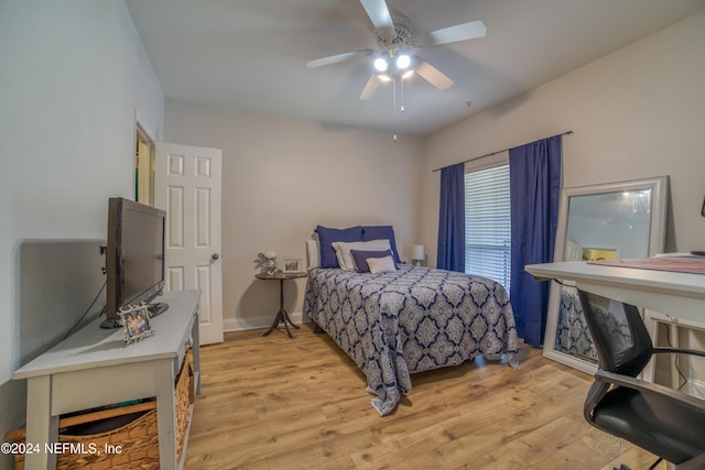 bedroom with light wood-type flooring and ceiling fan