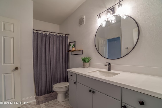 bathroom featuring a shower with curtain, vanity, and toilet