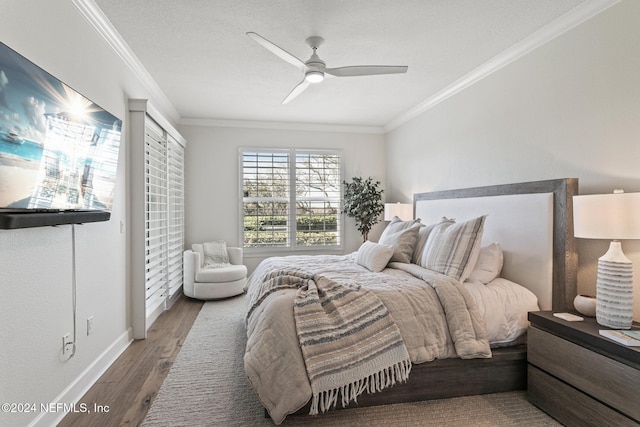 415 N Ocean Grande Dr Unit 101, Ponte Vedra Beach, FL 32082 - bedroom featuring ornamental molding, wood finished floors, baseboards, and ceiling fan