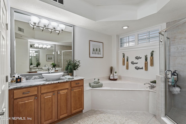 415 N Ocean Grande Dr Unit 101, Ponte Vedra Beach, FL 32082 - full bathroom featuring a garden tub, vanity, tile patterned floors, and a shower stall