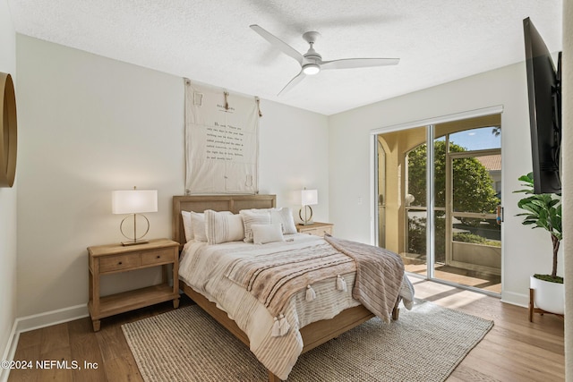415 N Ocean Grande Dr Unit 101, Ponte Vedra Beach, FL 32082 - bedroom with access to outside, light wood finished floors, baseboards, a textured ceiling, and ceiling fan