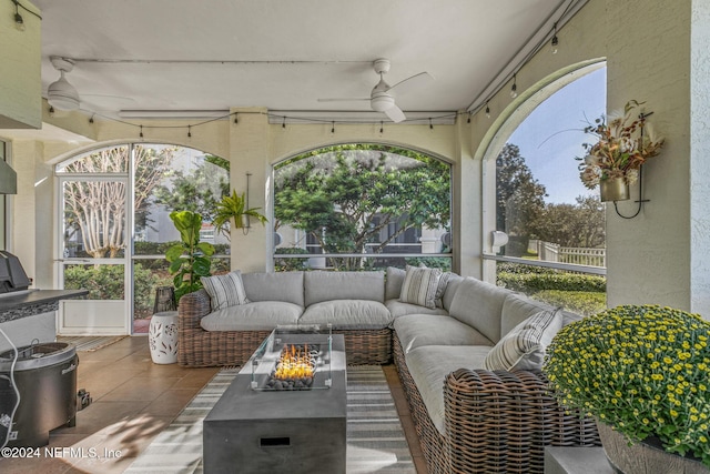 415 N Ocean Grande Dr Unit 101, Ponte Vedra Beach, FL 32082 - sunroom with an outdoor living space with a fire pit and a ceiling fan