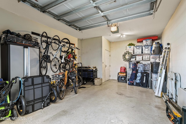 415 N Ocean Grande Dr Unit 101, Ponte Vedra Beach, FL 32082 - garage featuring concrete block wall and a garage door opener