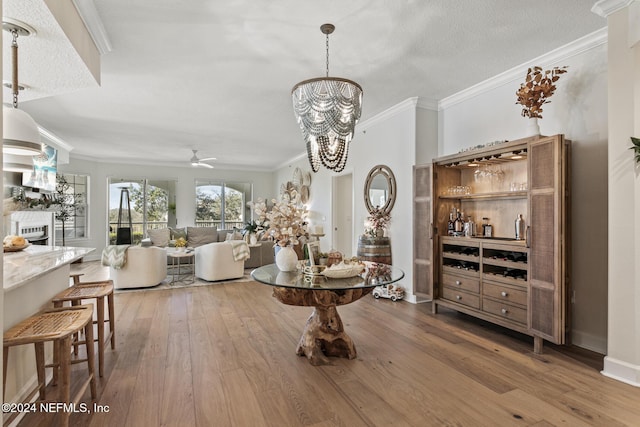 415 N Ocean Grande Dr Unit 101, Ponte Vedra Beach, FL 32082 - dining area with hardwood / wood-style floors, crown molding, ceiling fan, and a chandelier