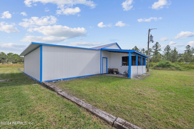 view of outbuilding featuring a yard