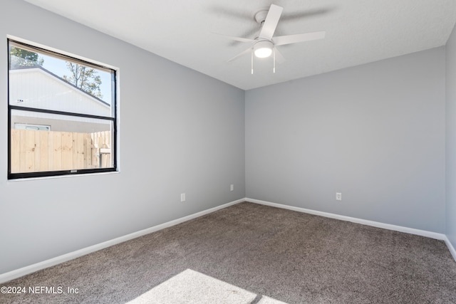 carpeted empty room with ceiling fan