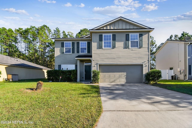 view of front property featuring central AC, a front lawn, and a garage