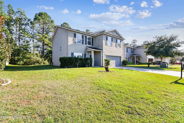 front of property featuring a front lawn and a garage