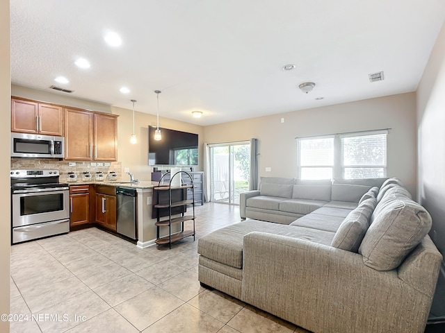 tiled living room featuring sink