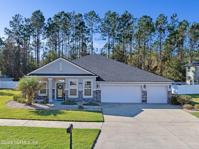 view of front facade featuring a front lawn and a garage