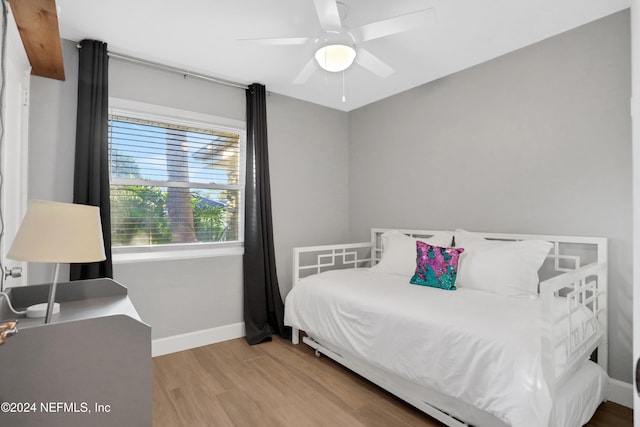 bedroom featuring hardwood / wood-style floors and ceiling fan