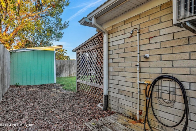 view of side of property with a shed