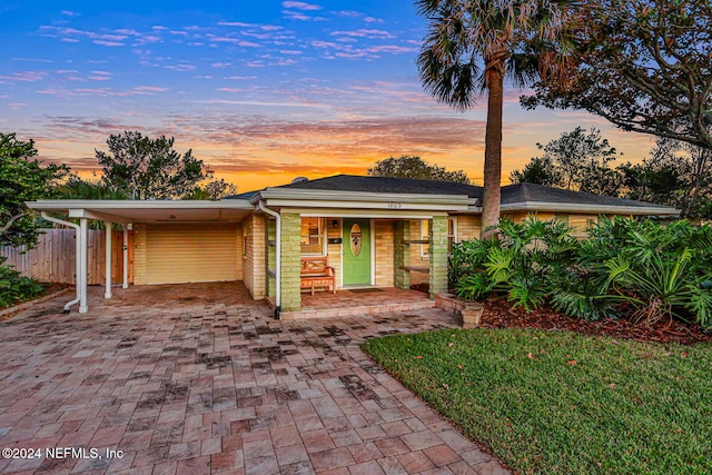 view of front of home with a carport