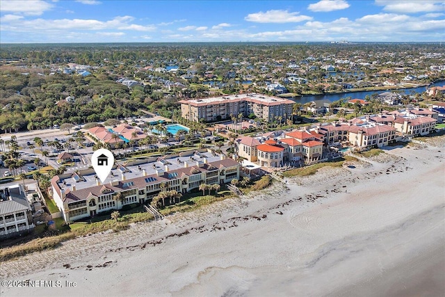 aerial view with a view of the beach and a water view