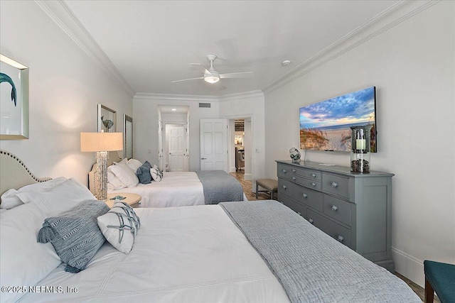 bedroom featuring ceiling fan and ornamental molding