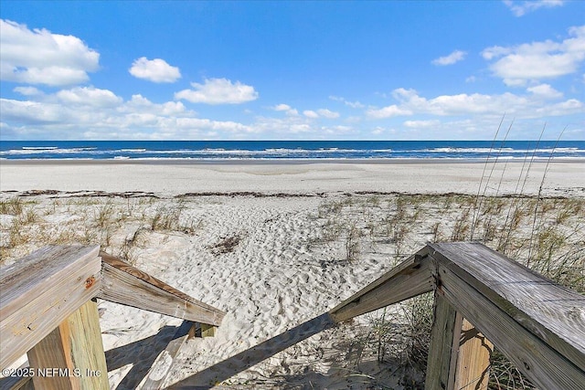 view of water feature with a beach view