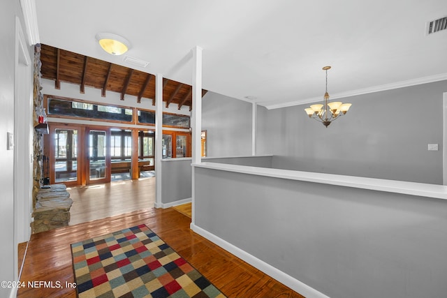 corridor with a notable chandelier and dark hardwood / wood-style floors