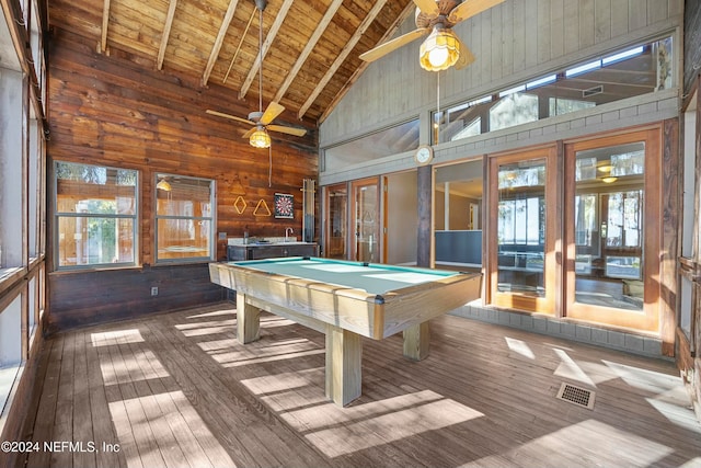 recreation room featuring wooden walls, beam ceiling, hardwood / wood-style flooring, high vaulted ceiling, and pool table