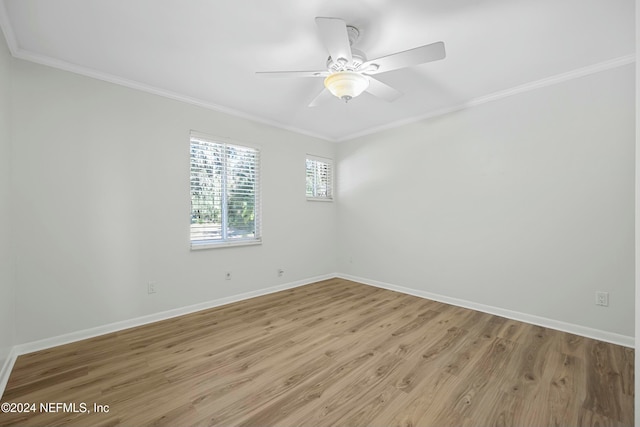 spare room with ceiling fan, light hardwood / wood-style floors, and crown molding