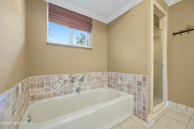 bathroom featuring tile patterned flooring, independent shower and bath, and ornamental molding