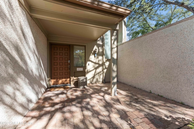 property entrance with a patio