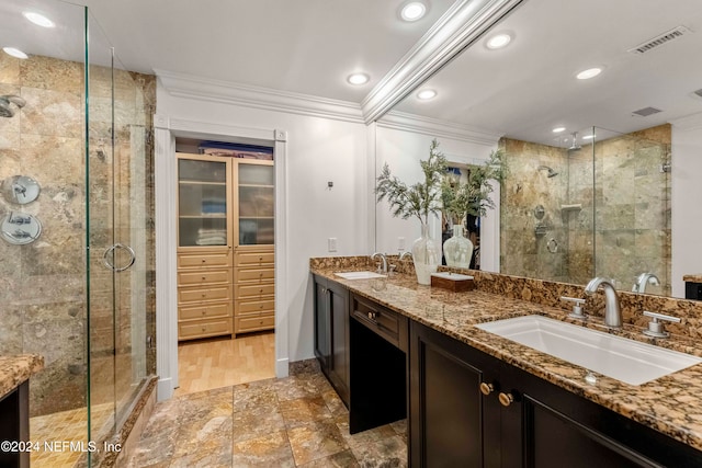 bathroom with crown molding, vanity, a shower with shower door, and hardwood / wood-style flooring