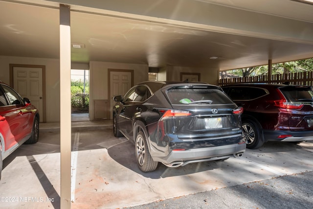 garage featuring a carport