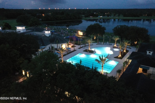 view of pool with a water view