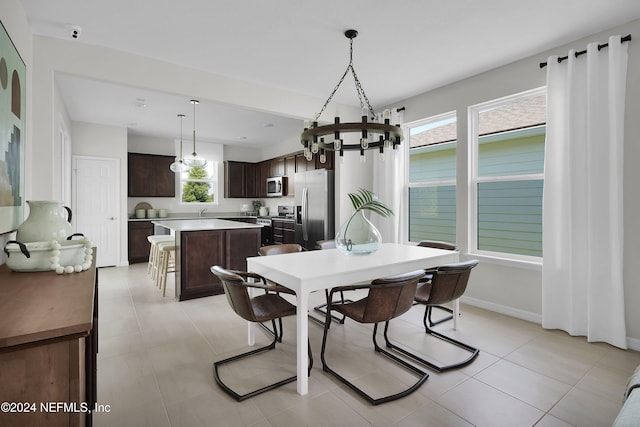 dining area with light tile patterned flooring