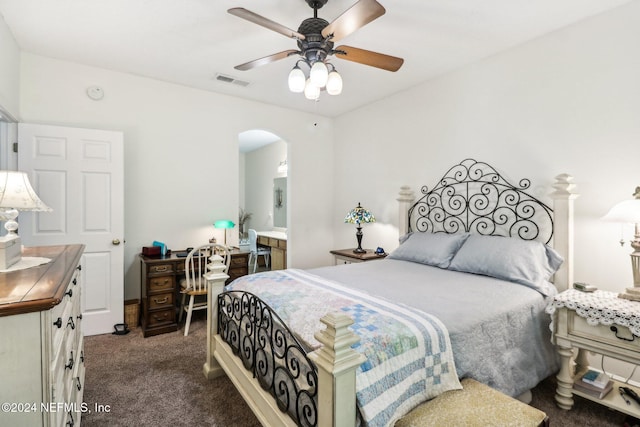 bedroom with ceiling fan and dark colored carpet