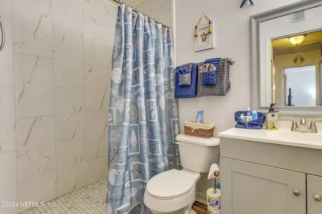 bathroom featuring vanity, toilet, and walk in shower