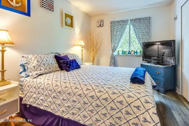 bedroom featuring dark wood-type flooring