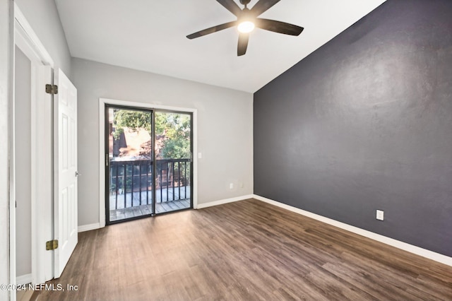 spare room featuring hardwood / wood-style floors, ceiling fan, and vaulted ceiling