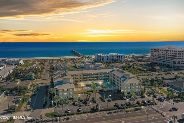 aerial view at dusk with a water view