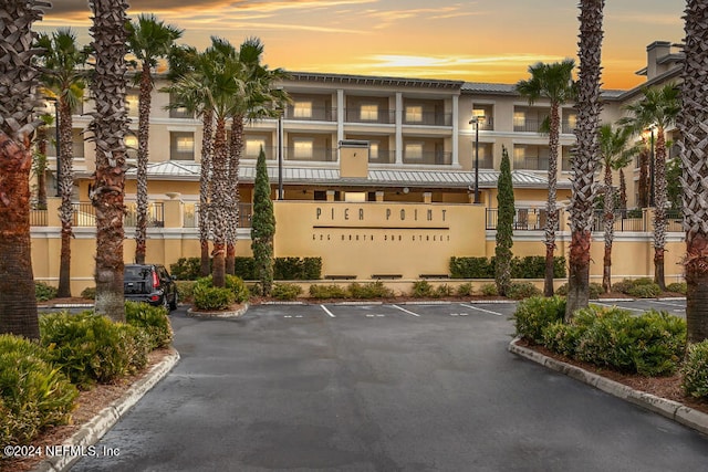 view of outdoor building at dusk