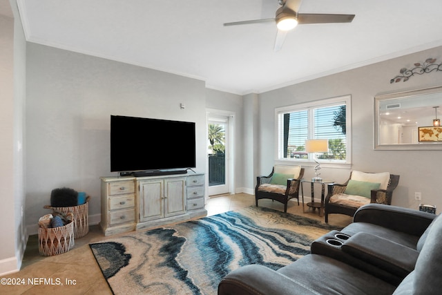 tiled living room with ceiling fan and crown molding