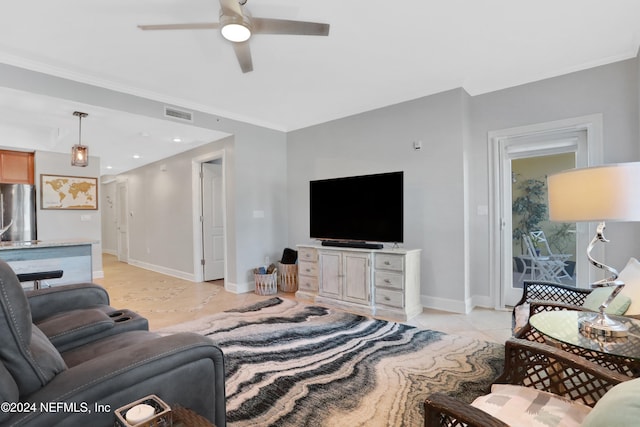 living room with ceiling fan, light tile patterned floors, and ornamental molding