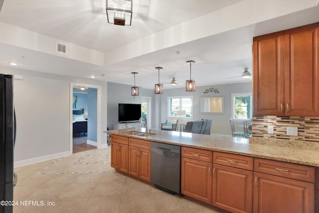 kitchen with light stone countertops, decorative backsplash, stainless steel dishwasher, ceiling fan, and sink