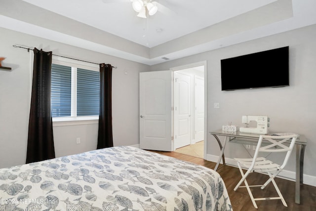 bedroom featuring hardwood / wood-style floors and ceiling fan