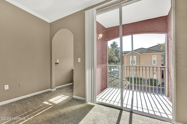 doorway to outside with carpet flooring and ornamental molding